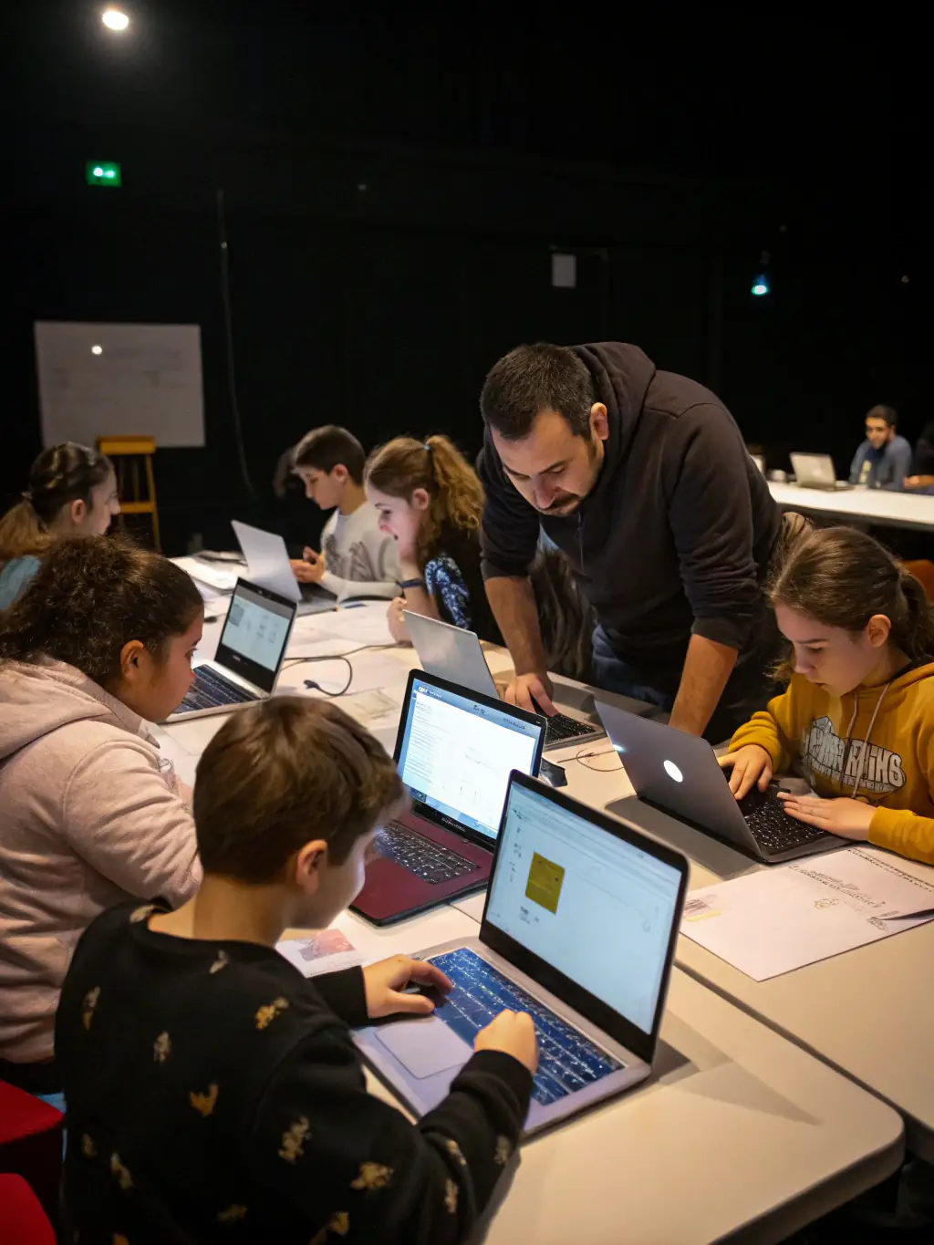 A collaborative coding session with students working together on database design, emphasizing teamwork and problem-solving.